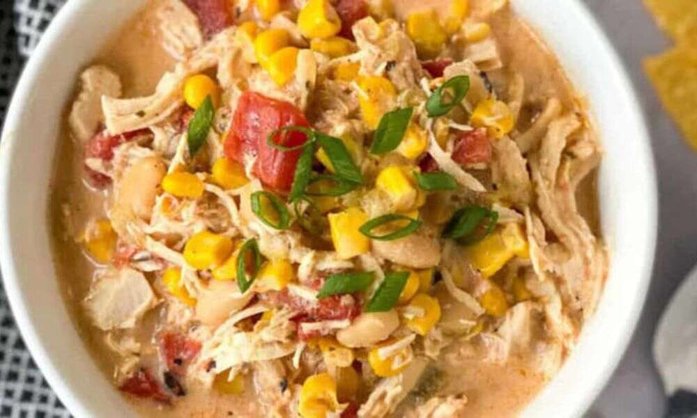 Creamy chicken served with rice, noodles, and steamed vegetables on plates